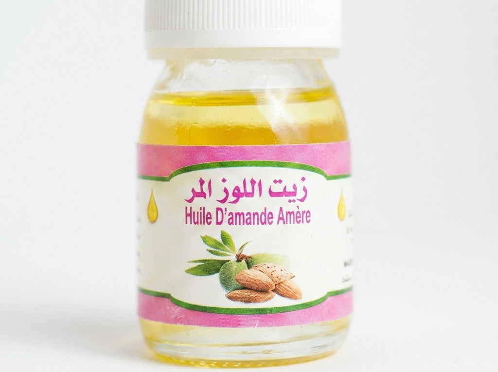 Application locale et ciblée de l'huile d'amande amère pure sur les taches brunes du visage le soir.