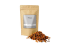 Sachet d'apothicaire en kraft de Graines d'Eïn El Farouj Orianza Selection, encens rouge et noir avec quelques graines à côté.