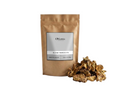Sachet d'apothicaire en kraft d'Aldad Marocain Orianza Selection, racine brute pour soin du corps avec quelques morceaux à côté.