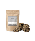 Sachet d'apothicaire en kraft de Hab El Machabek Orianza Selection, encens traditionnel en graines avec quelques morceaux à côté.