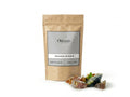 Sachet d'apothicaire en kraft de Benjoin Jaoui Mixte Orianza Selection, résines de purification avec quelques larmes de résine à côté.