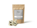 Sachet d'apothicaire en kraft de Benjoin Blanc Orianza Selection, Jaoui pur pour purification avec quelques larmes de résine à côté.
