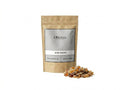 Sachet d'apothicaire en kraft d'Oum Ennas Orianza Selection, gomme ammoniaque pure pour purification avec quelques morceaux à côté.