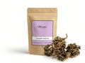 Sachet d'apothicaire en kraft de Rose de Jéricho Orianza Selection, Chajarat Mariam pure pour la fertilité avec la plante fermée à côté.