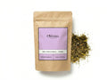 Sachet d'apothicaire en kraft de Rue Officinale Orianza Selection, Fidjel pur pour purification avec quelques feuilles à côté.
